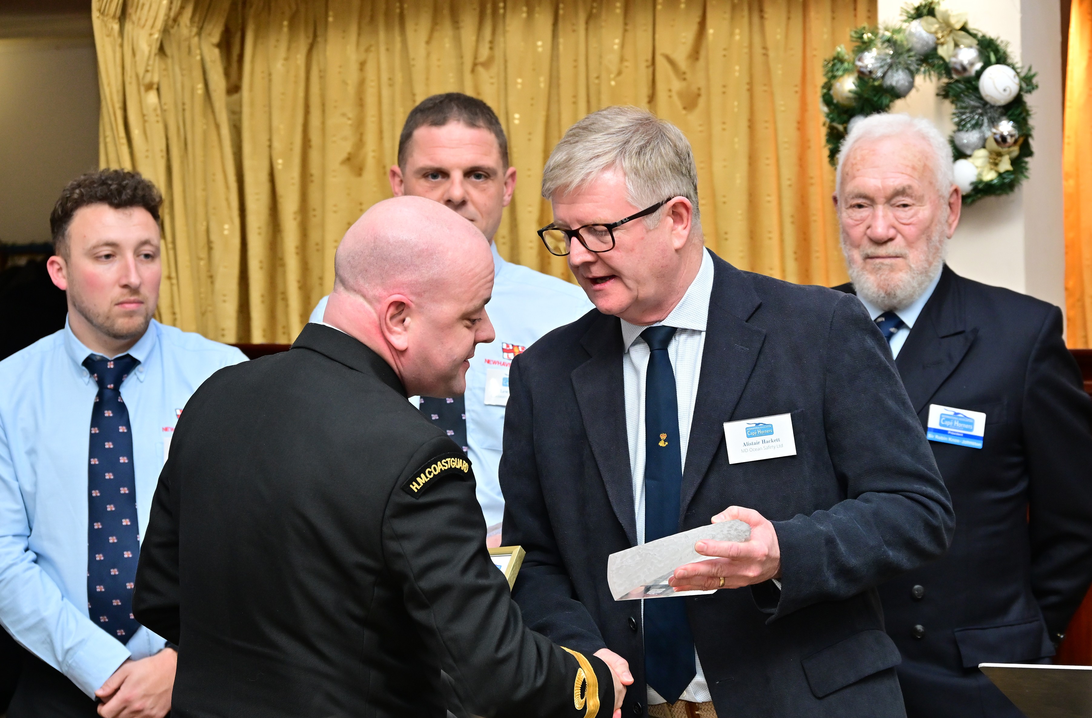 Assistant Chief Coastguard Matt Leat is accepts the award on behalf on the helicopter crew