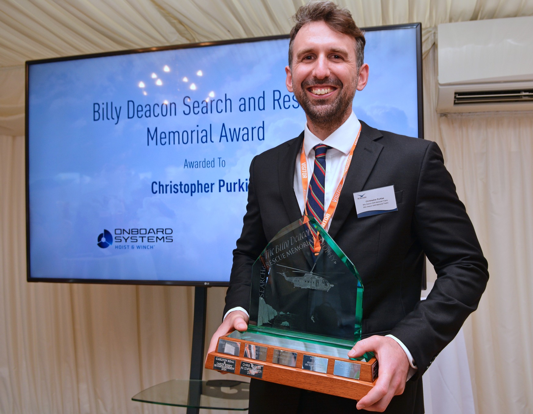 Winch Paramedic Chris Purkiss with the Billy Deacon SAR Memorial Trophy