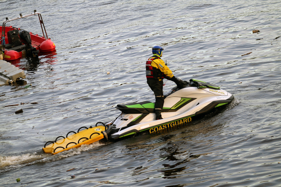 A HM Coastguard rescue vehicle on the water