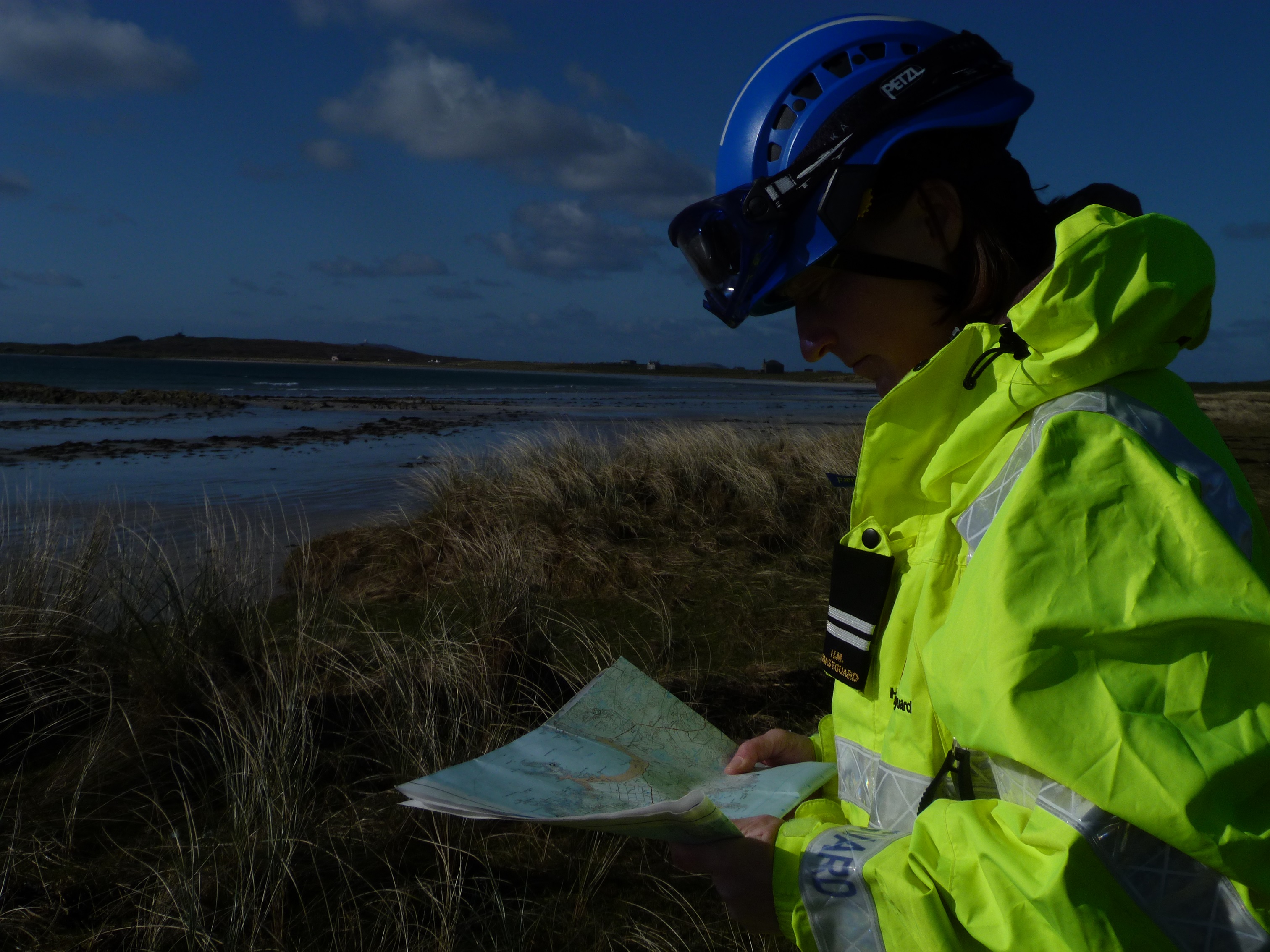 Hayley Douglas, Deputy Station Officer at Isle of Tiree by the coast wearing protective kit