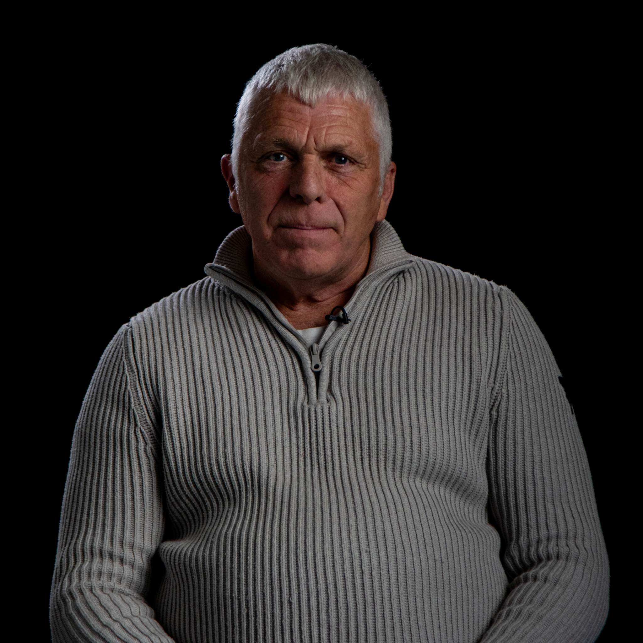 Bruce Mitchell sat in a grey sweater