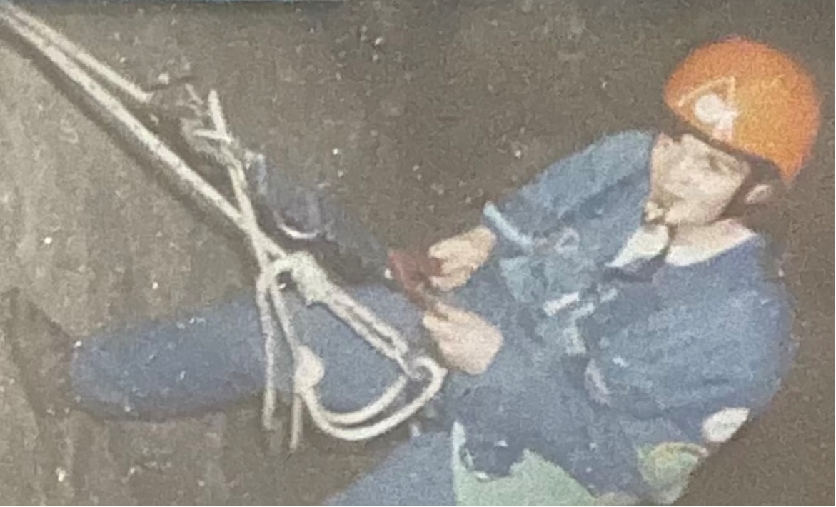 Nicola Davies abseiling on a cliff