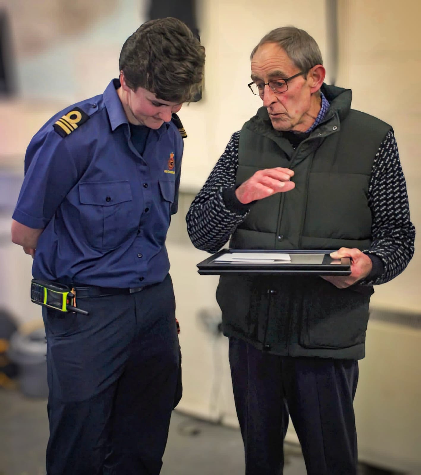 Paul 'Bud' White chats with a uniformed coastguard