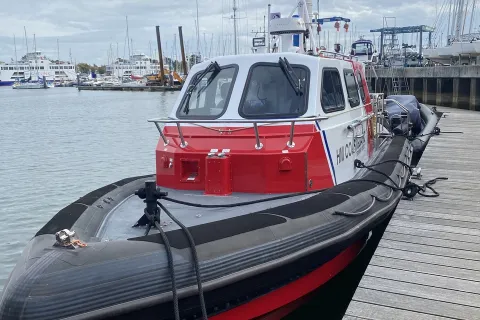 An HM Coastguard training vessel moored up