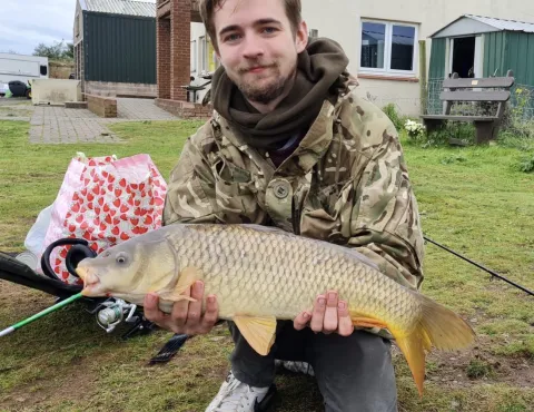Tom Thorburn pictured with a large fish held in both hands