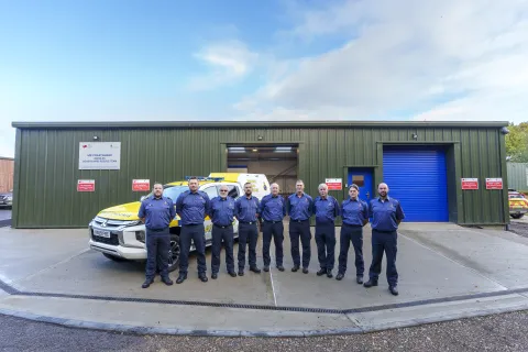 Needles Coastguard Rescue Team standing outside their new station