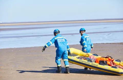 Coastguard Rescue Officers conducting a mud rescue 