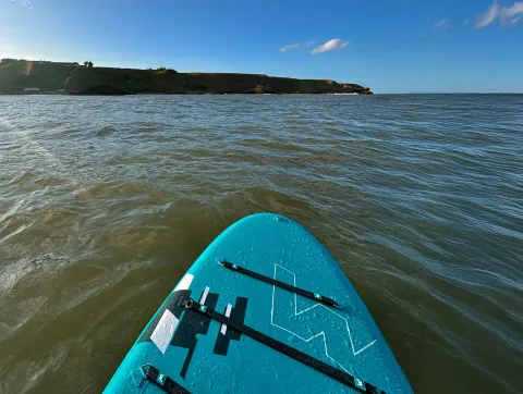 Stand up paddleboarding at Catterline Bay
