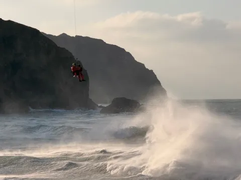 HM Coastguard Search and Rescue Helicopter R924 effects a rescue at Perranporth. December 2025. 