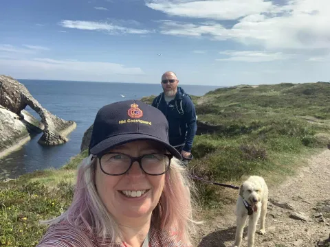 Kate McManus Coyle with her husband Gary and dog Arwen.