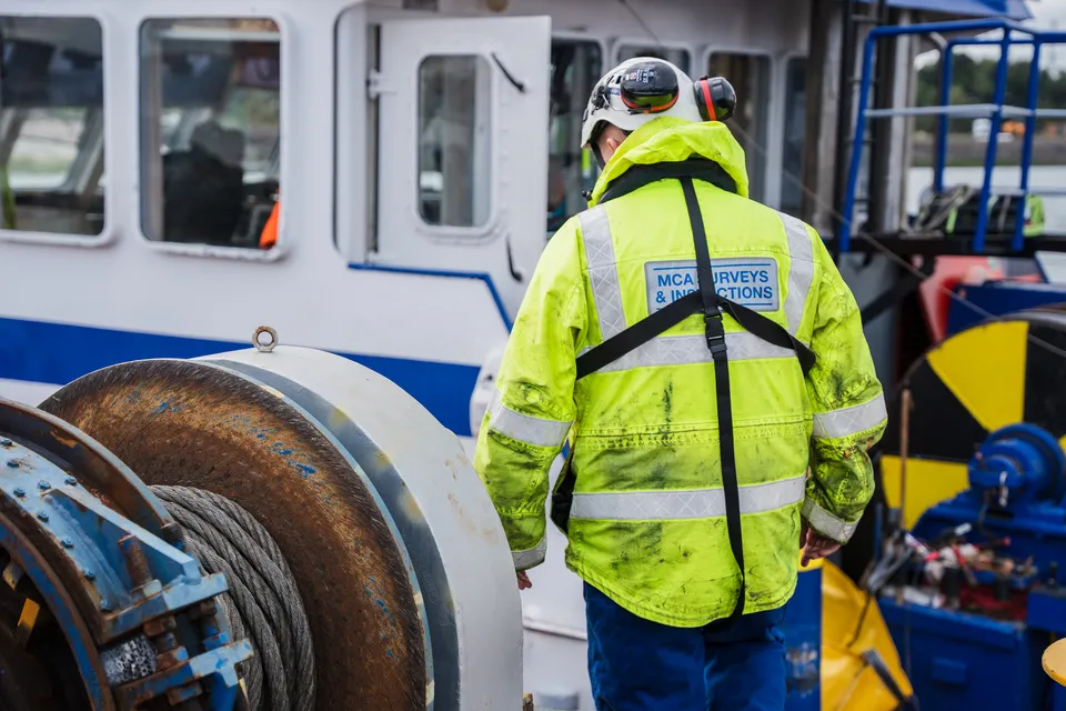 An MCA Surveyor inspects a vessel 