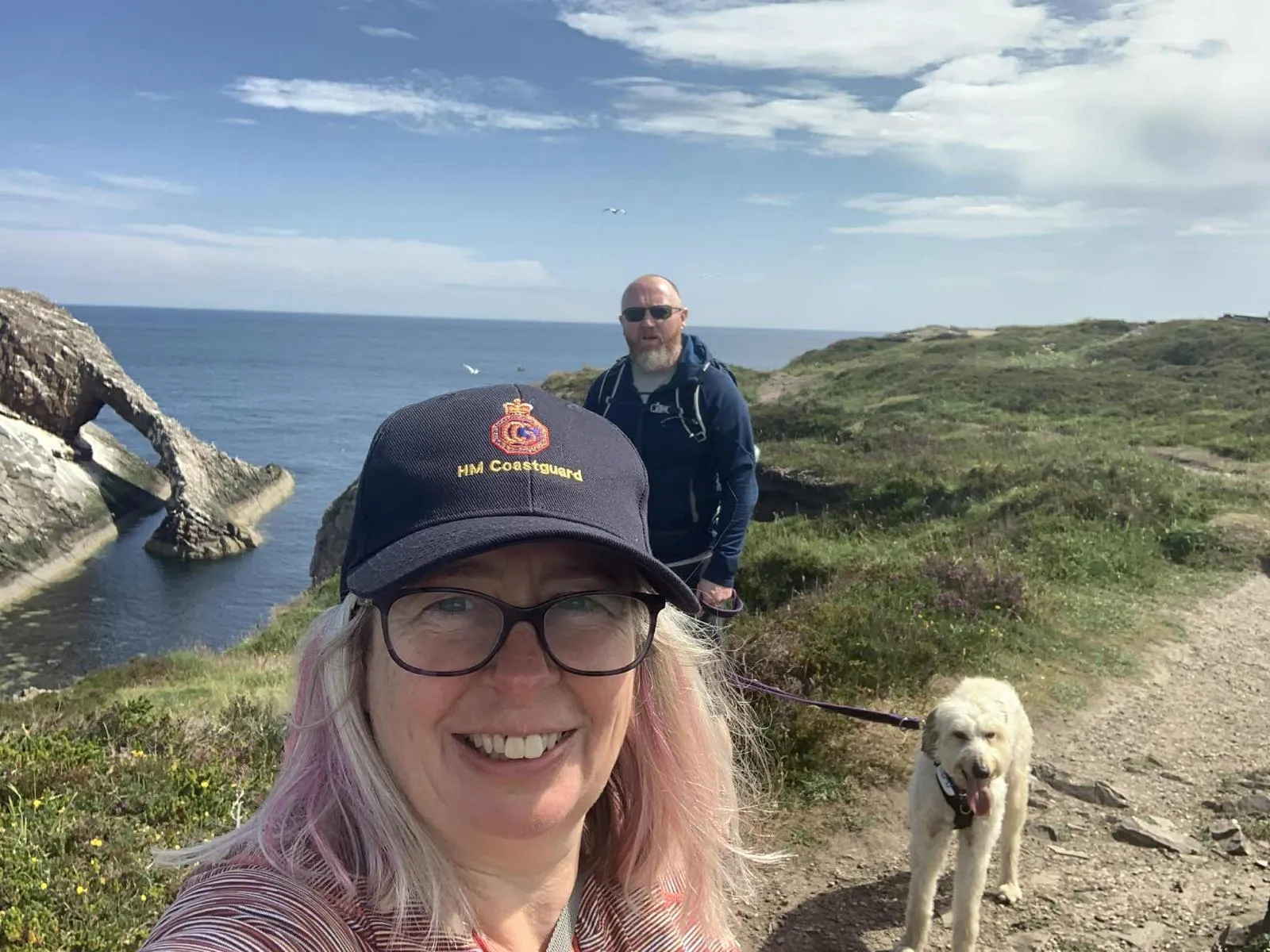 Kate McManus Coyle with her husband Gary and dog Arwen.