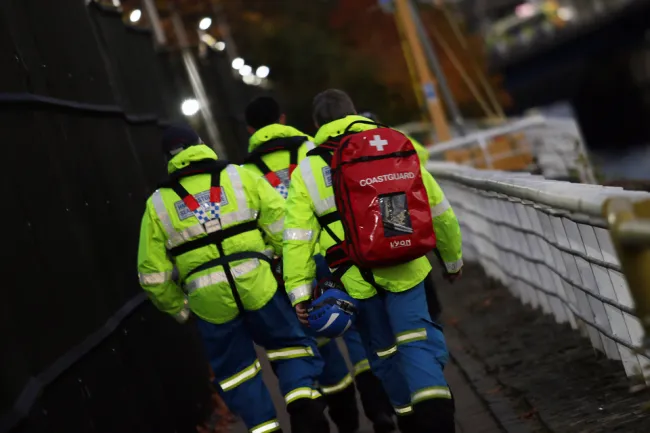 HM Coastguard rescue team walking along the Clyde Waterfront ahead of COP26