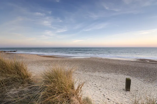 View of an sandy beach with the sea beyond
