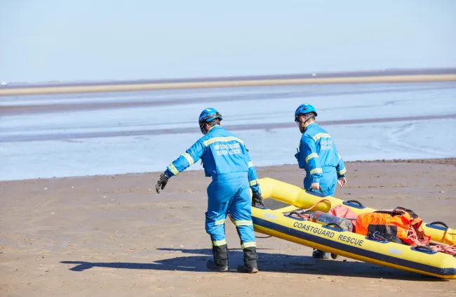 Coastguard Rescue Officers conducting a mud rescue 
