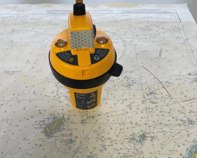 An EPIRB placed on a map showing where Chris Cowlard was rescued