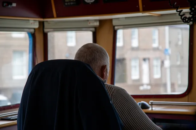 Fishing skipper Bruce Mitchell looks out the windows of his vessel