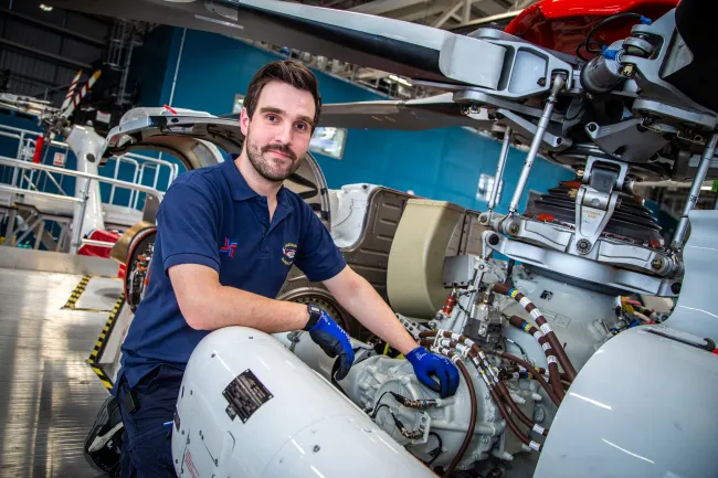 B1 Mechanical Engineer Mike Ratcliffe with a AW139 Search and Rescue Helicopter